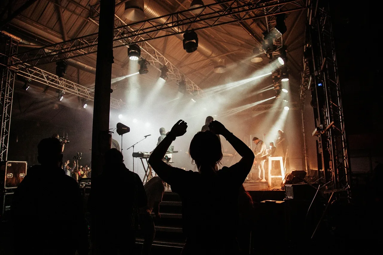 Concert crowd enjoying music event with QR code photo sharing